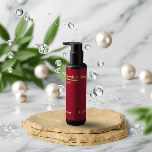 Treasure9 Tea Tree Cleanser Red bottle with pump on a wooden platform surrounded by pearls and green leaves on a marble background 100 ml
