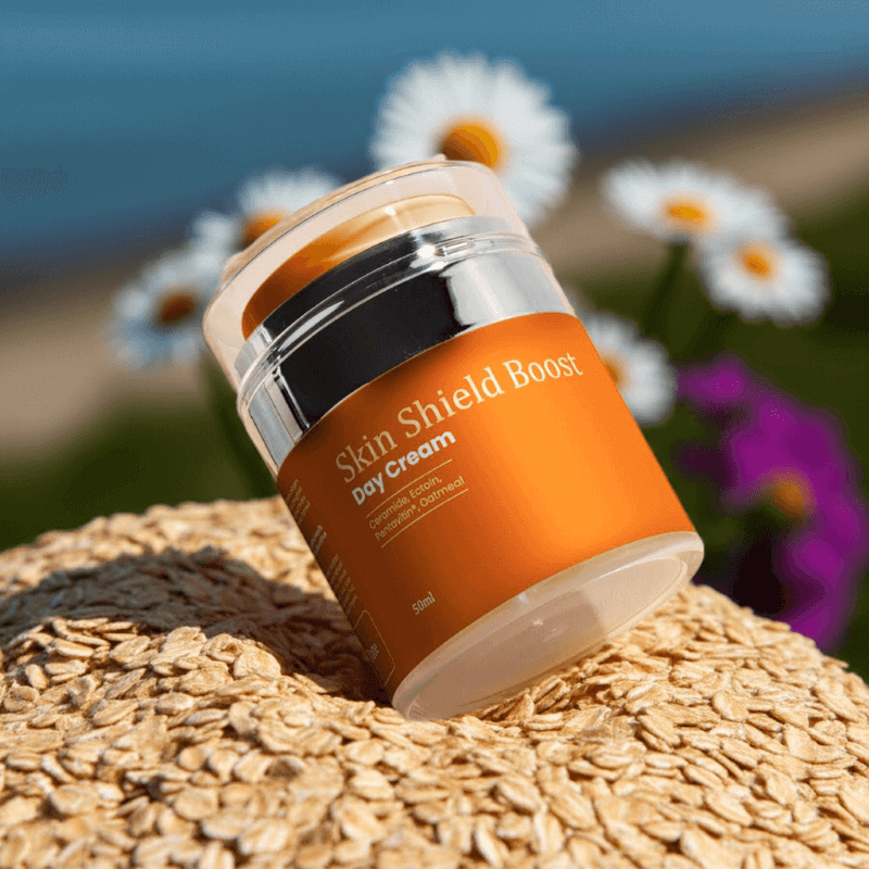Treasure9 Skin Barrier Skin Shield Boost Day Cream amber jar on a woven  oatmeal surface with flowers in the background